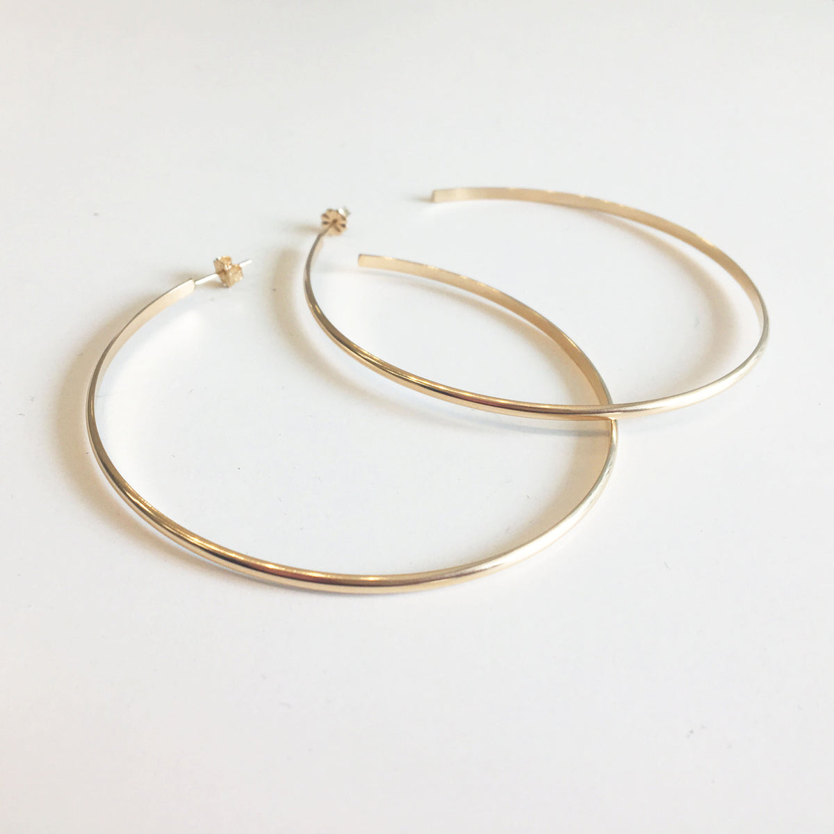 oversized hoop earrings in gold for sale on glamrocks jewelry