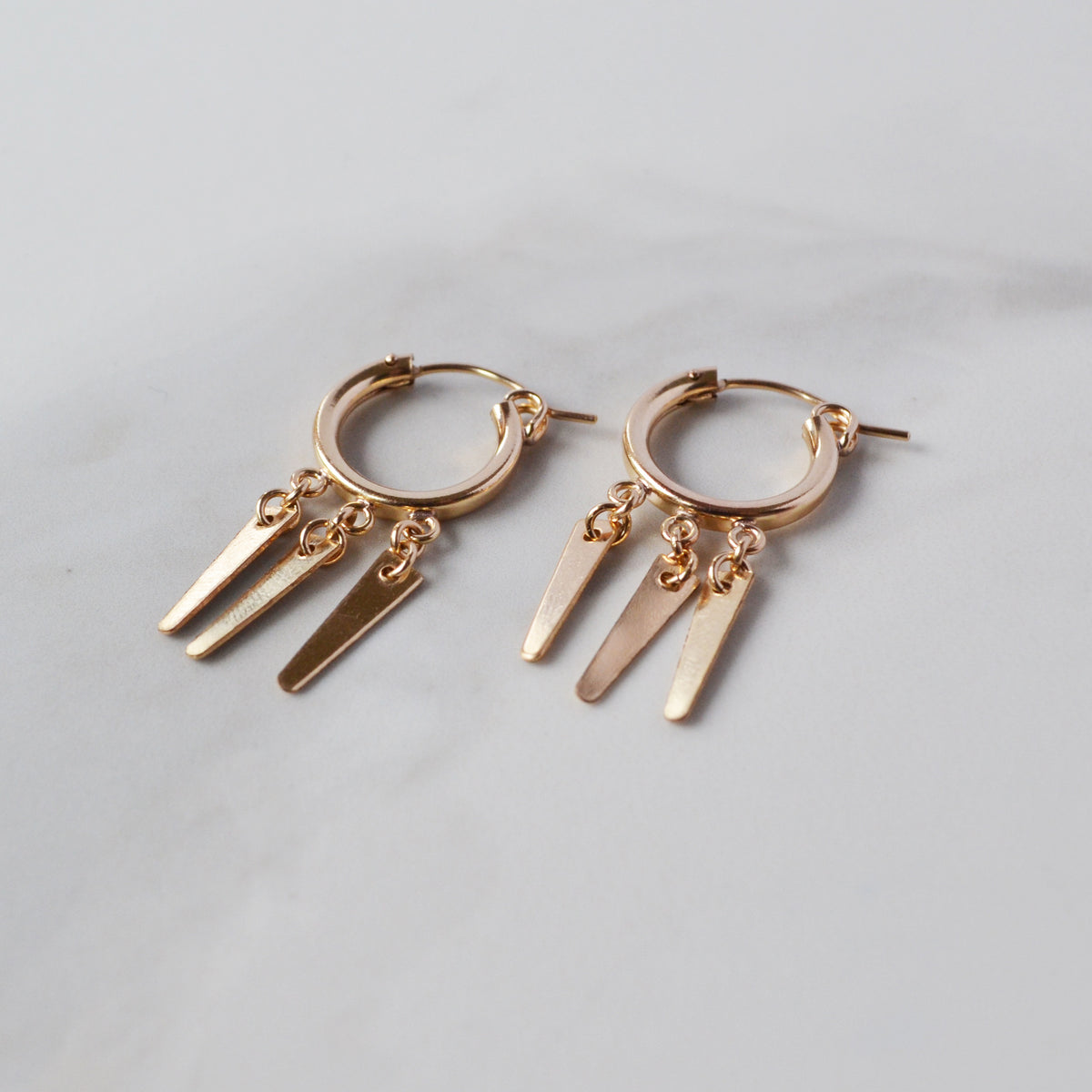 Gold spike huggie earrings