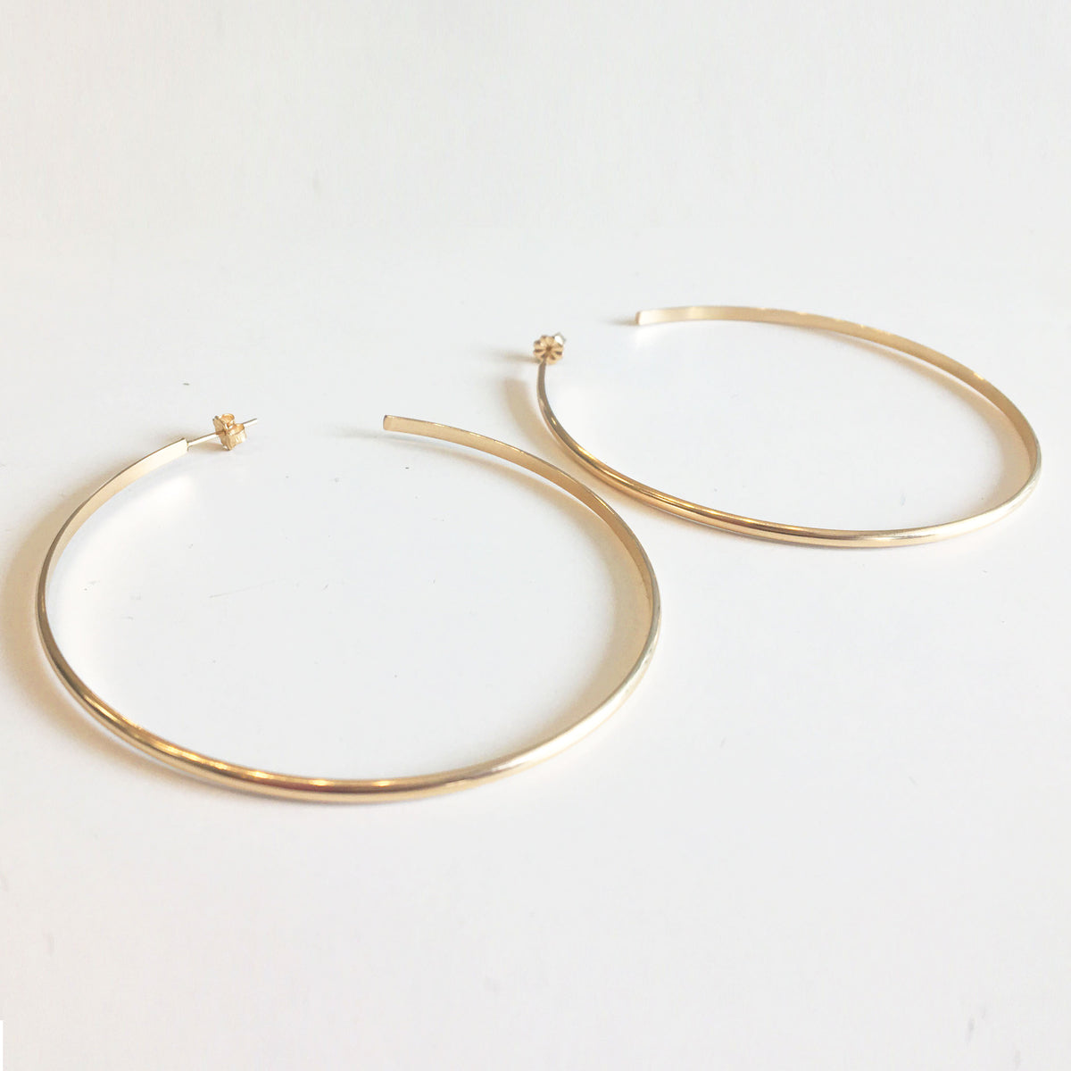 oversized hoop earrings in gold for sale on glamrocks jewelry